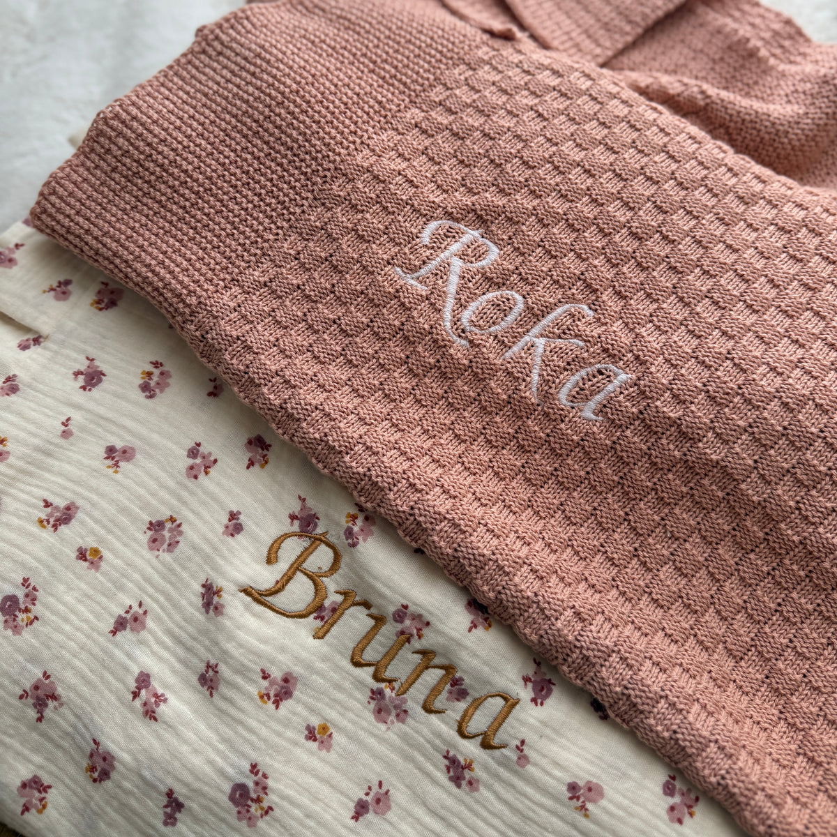 Embroidered headband with 'Simie' on a neutral background