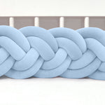 Braided light blue fabric on a white background