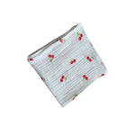 Baby Natur white muslin cloth with a red cherry print. Made from 100% cotton, perfect for babies.
