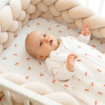 Baby Natur white sleeveless sleeping bag with red cherry print, made of soft, breathable cotton. For safe, comfortable sleep.
