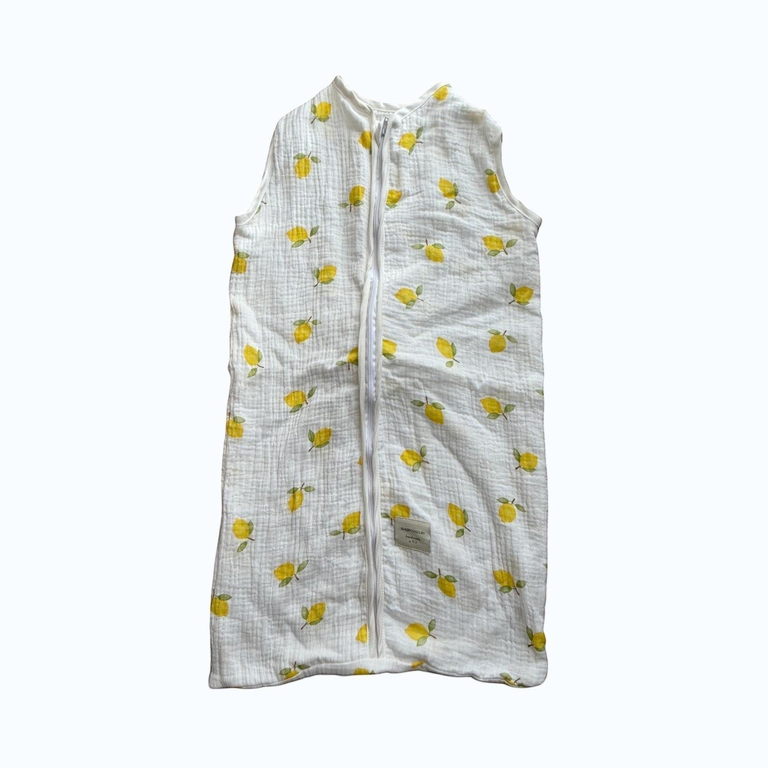 Baby Natur sleeveless sleeping bag with yellow lemons print, made of soft, breathable cotton. Perfect for safe and comfortable sleep.