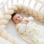 Baby Natur sleeveless sleeping bag with yellow lemon print, made from soft, breathable cotton for safe sleep.