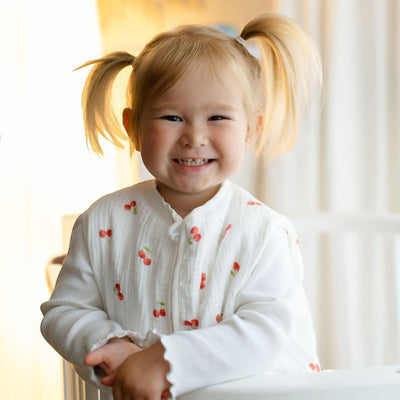 Baby Natur white 100% tetra muslin sleep sack with cherry print and scalloped cuffs. For babies.