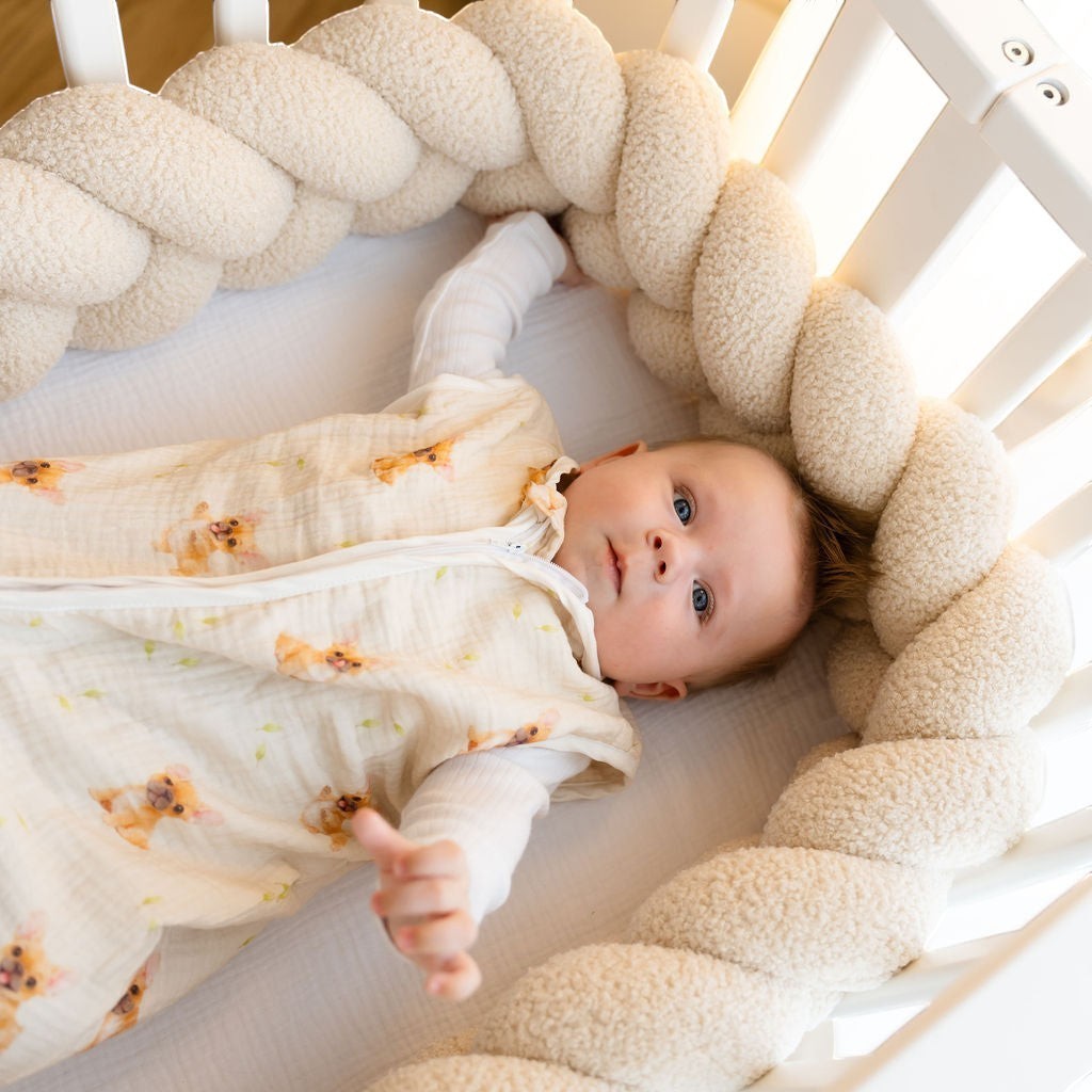 Baby Natur sleeveless sleeping bag in cream with a cute dog print, made from soft, breathable cotton for safe and comfortable sleep.