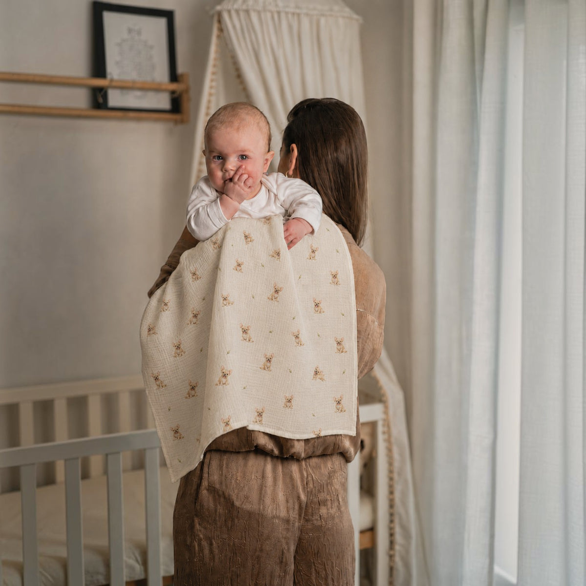 Baby NaturA 100% cotton muslin swaddle blanket with a French bulldog print, perfect for burping or as a crib liner.