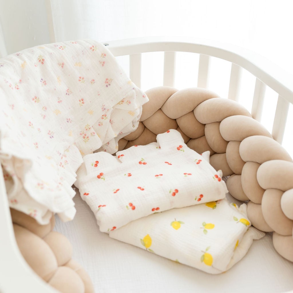 Baby NaturMuslin swaddle blankets with cherry and lemon prints, soft and breathable for cribs and strollers.