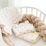 Baby NaturMuslin swaddle blankets with cherry and lemon prints, soft and breathable for cribs and strollers.