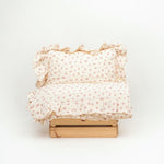 Baby Natur Tetra muslin bedding set with ruffles and a small floral print in cream and pink. 100% organic cotton.